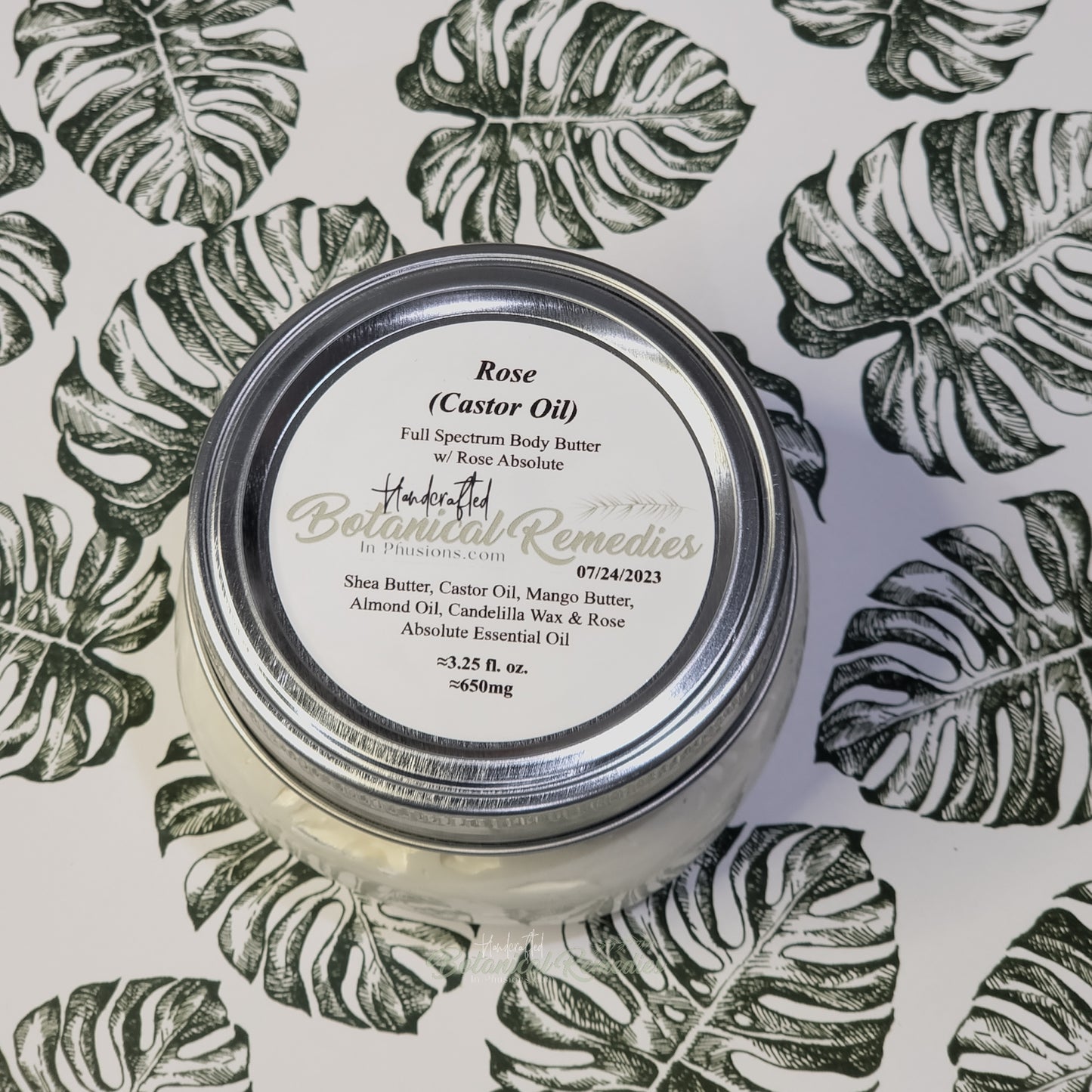 clear mason jar with white body butter inside